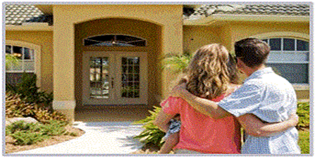 A person and person hugging in front of a house

Description automatically generated
